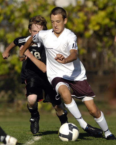 GHS_CHS_DSC3162b James Burton sprints past a Century defender as he works his way for a shot outside the penalty box. Burton scored two goals in Glencoe's 8-0 home victory.