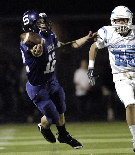 SHS_LHS_DSC8789b Ty Harper (12) of Sunset goes full stretch in attempt to pull in a deep pass during the second quarter.