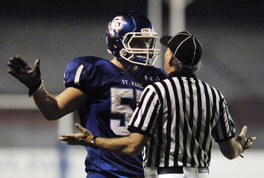 SPHS_PHS_DSC9129b David Ferguson of St. Paul questions a penalty call with the referee after the Buckaroos scored the two point conversion with 1:20 left in the second quarter for a 14-0 lead. The flag was ultimately withdrawn the the conversion was good.