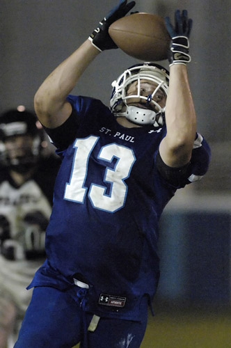 SPHS_PHS_DSC9626b TJ Weisz of St. Paul pulls in a pass reception for a 20 yard first down with 4:00 remaining in the fourth quarter.