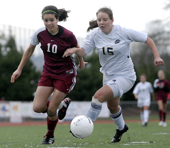 BHS_SHS_DSC3966b Amelia Salazar (left) of Sherwood and Kelsey Greene (right) of Bend battle for the ball as Salazar attempts to turn towards goal near the Bend endline.