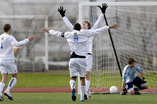 CHS_MVHS_DSC5745b Zane Meehan of Corvallis throws his arms into the air in celebration after converting a penalty kick that put the Spartans into the lead for good at 2-1 with 8:05 left in the match after a deliberate hand ball in the box resulted in the sending off of Mt. View's Mike Wood.
