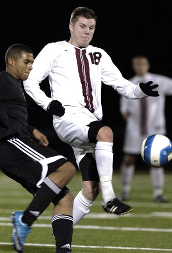 GHS_CHS_DSC2994b Eirik Sagstad (right) of Glencoe challenges Corvallis midfielder Jamal Abdoul for a ball during first half play.