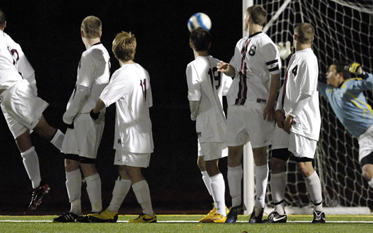 GHS_CHS_DSC3583_1b The Glencoe wall watches the flight of Banner Schafler's free kick as keeper Dillon Vanaken dives in attempt to stop it from tucking inside the left post. Schafer's 20 yard blast put Corvallis up 2-0 in the 28th minute of the seoncd half.