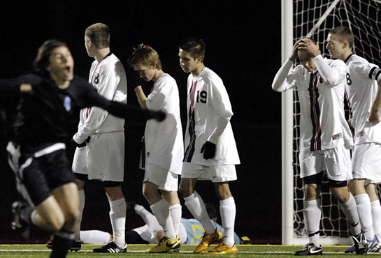 GHS_CHS_DSC3585b The Glencoe defense reacts after going down 0-2 as Corvallis goal-scorer Banner Schafer (in black) celebrates by sprinting to the stands after hitting a laser accurate 20 yard free kick.
