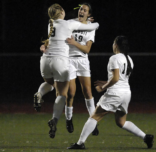 JHS_WHS_DSC8831b Kelli Crandall (left) and Sarah Bridges (center) of Jesuit embrace and leap into the air in celebration of Bridges' goal with 34:11 left in the match giving the Crusaders a 1-0 lead. Teammate Emily Fellows (right) also joined in the celebration.