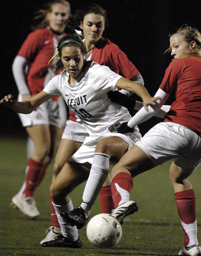 JSH_WHS_DSC8737b Sarah Bridges (left) of Jesuit edges past Westview's Kelsey Henningsen (right) as she works her way down the wing.