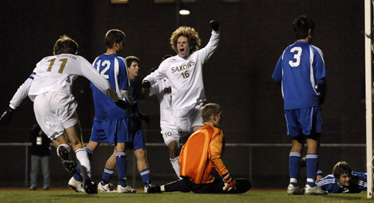 SSHS_SMHS_DSC4200b Ethan Jones of South Salem cellebrates his game winning goal as South Medford keeper and his defensive players look hopelessly at the ball resting in their goalnet.